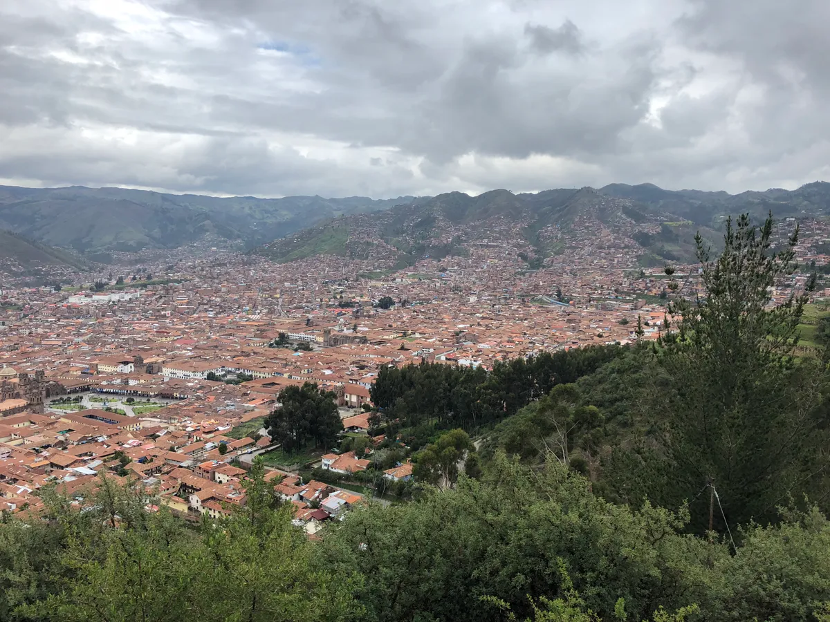 Cusco seen from above, rooftops against the Andes